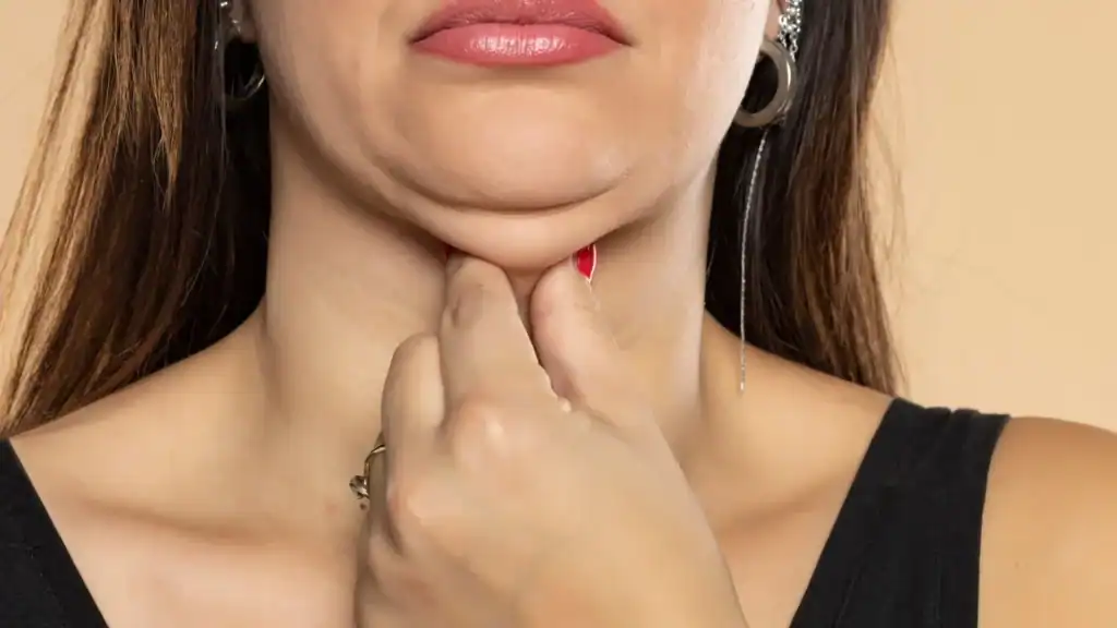 An image of a woman with double chin, sad, worried : Non Surgical Double Chin Removal Treatment in Scotstounhill, UK